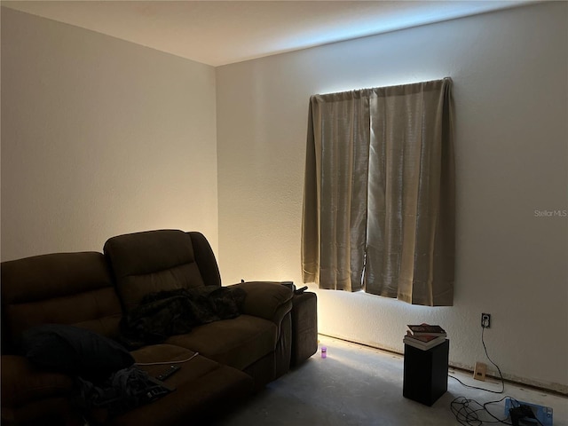 living room featuring concrete flooring