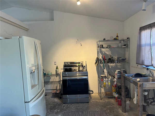 kitchen featuring stainless steel range with electric cooktop and white fridge with ice dispenser