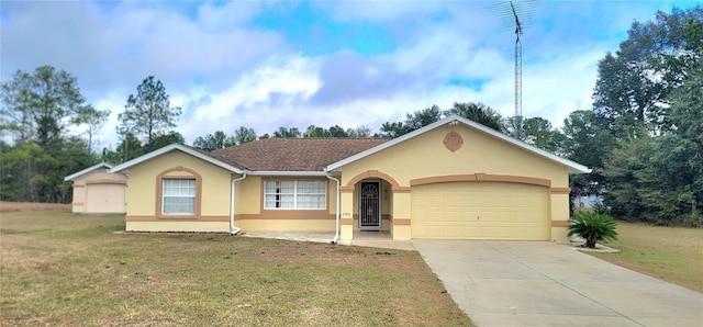 ranch-style house featuring a garage and a front lawn