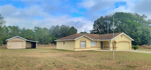 ranch-style house with a carport, an outdoor structure, covered porch, and a front lawn