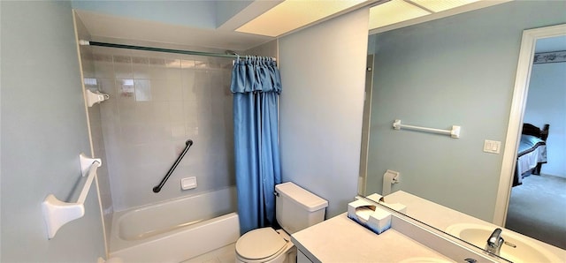 full bathroom with vanity, shower / tub combo with curtain, and toilet