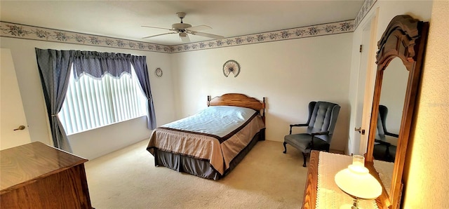 bedroom featuring light carpet and ceiling fan