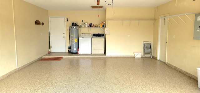 garage featuring independent washer and dryer, electric panel, and water heater