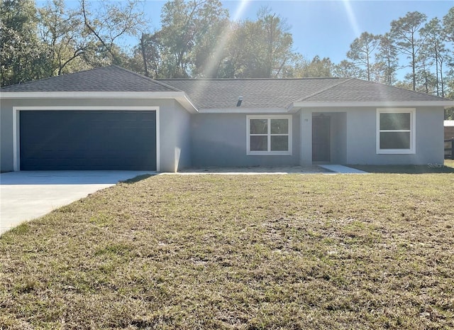 ranch-style home with a garage and a front yard