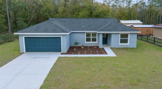 ranch-style house featuring a front lawn, an attached garage, fence, and a shingled roof