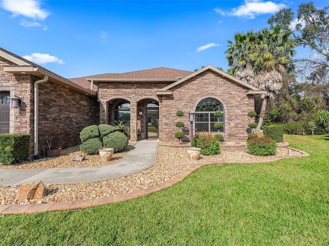 view of front of property with a front lawn