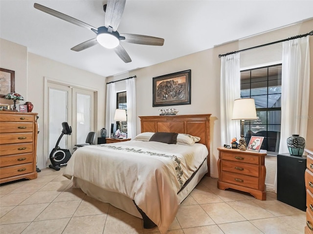 bedroom with light tile patterned floors and ceiling fan