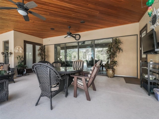 exterior space with wood ceiling, ceiling fan, and vaulted ceiling