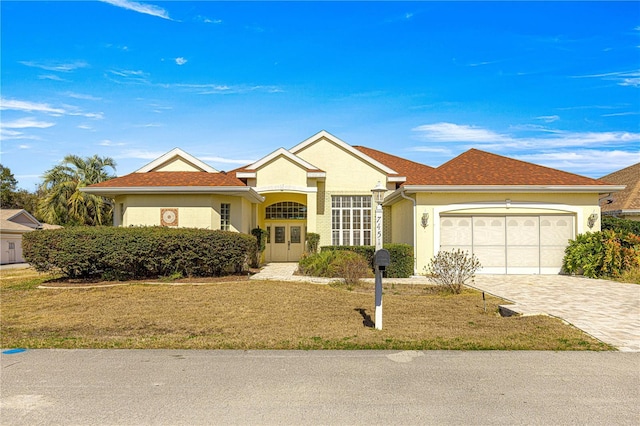 ranch-style home featuring a garage