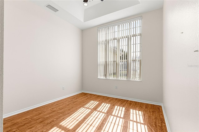 unfurnished room featuring ceiling fan and hardwood / wood-style floors