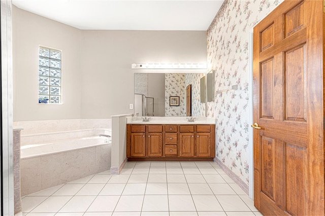 bathroom with vanity, tile patterned flooring, and a bathing tub