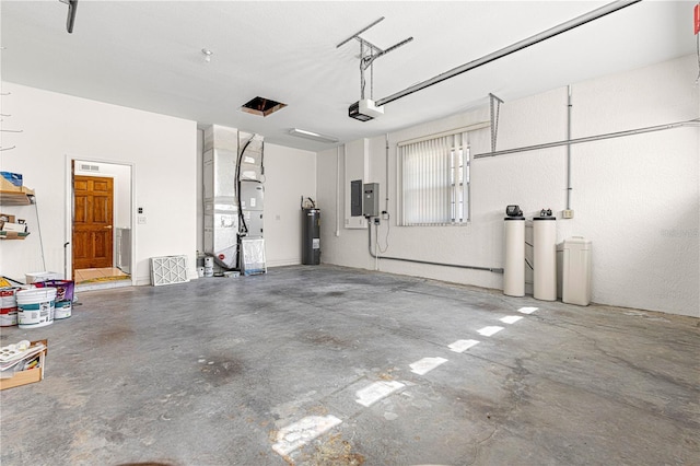 garage featuring heating unit, a garage door opener, electric panel, and electric water heater