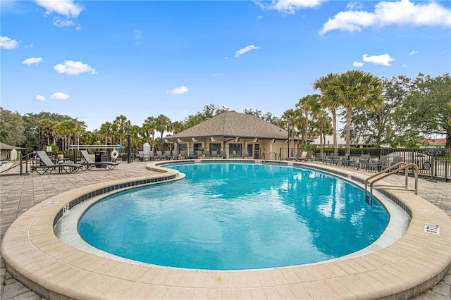 view of swimming pool featuring a patio area