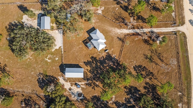 birds eye view of property with a rural view