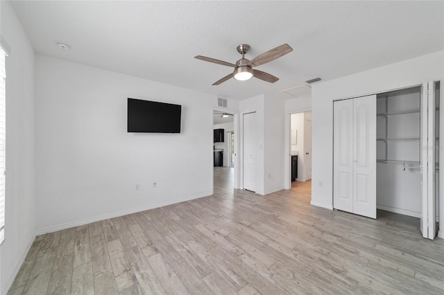 unfurnished bedroom featuring light hardwood / wood-style floors and ceiling fan