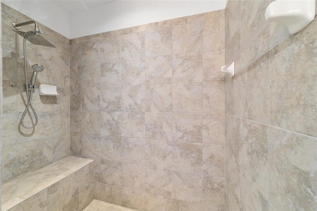 bathroom featuring tiled shower