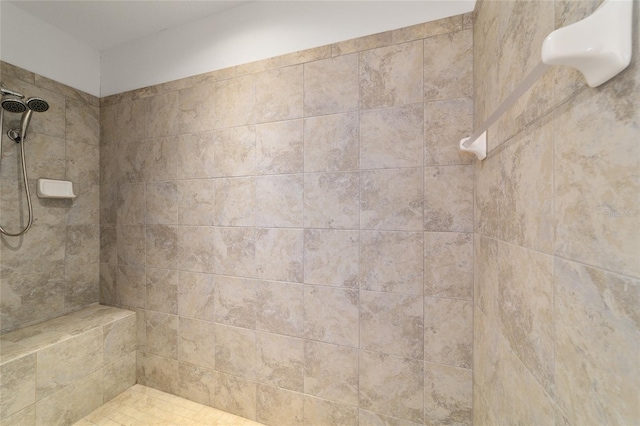 bathroom with tiled shower