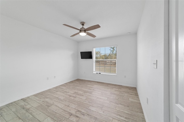 spare room featuring ceiling fan and light hardwood / wood-style floors