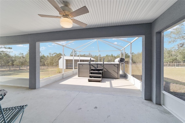 sunroom / solarium featuring ceiling fan