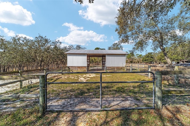 exterior space with an outbuilding and a rural view