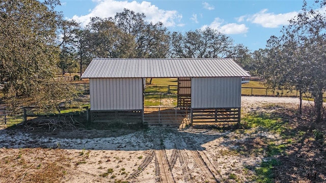 view of outdoor structure with a rural view