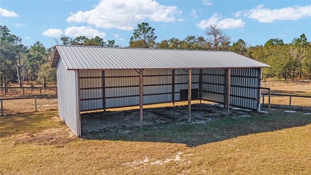 view of property's community featuring an outbuilding and a yard