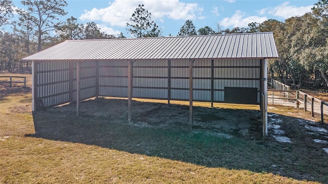 view of outdoor structure featuring a lawn