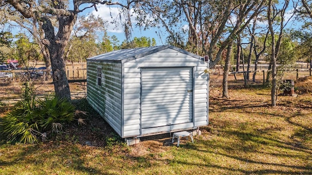 view of outdoor structure featuring a yard