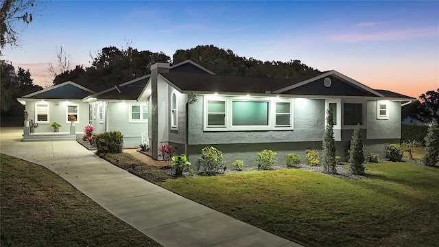 view of front of property with a yard