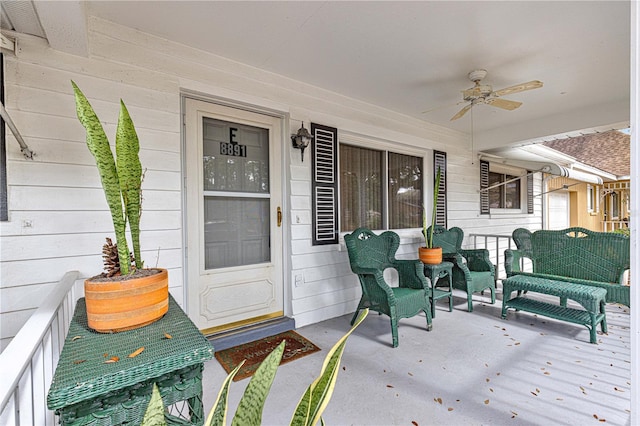 exterior space featuring ceiling fan and a porch