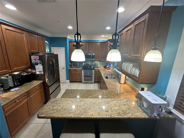 130 Harbour Cove Way, Clermont, FL 34711 - kitchen featuring appliances with stainless steel finishes, a sink, light stone countertops, crown molding, and hanging light fixtures