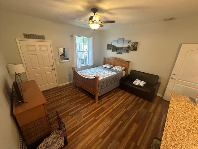 130 Harbour Cove Way, Clermont, FL 34711 - bedroom featuring dark wood finished floors, baseboards, and ceiling fan