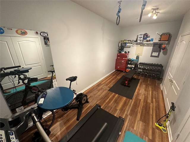 130 Harbour Cove Way, Clermont, FL 34711 - workout area featuring wood finished floors and baseboards