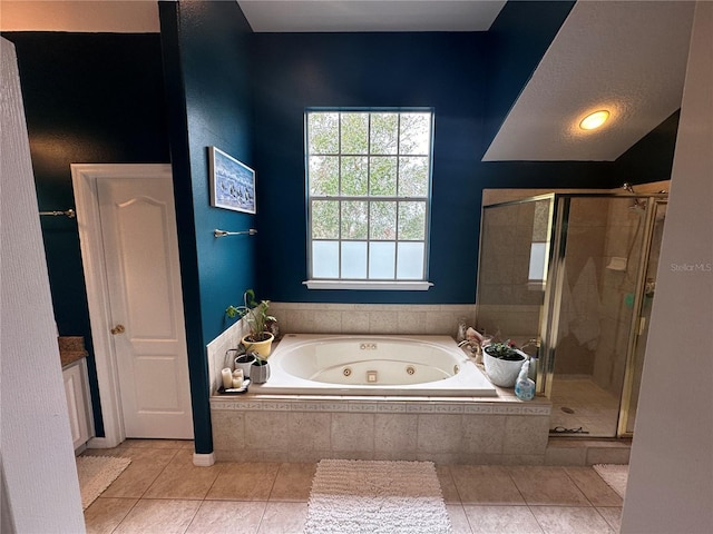 130 Harbour Cove Way, Clermont, FL 34711 - full bath with a jetted tub, a stall shower, and tile patterned floors