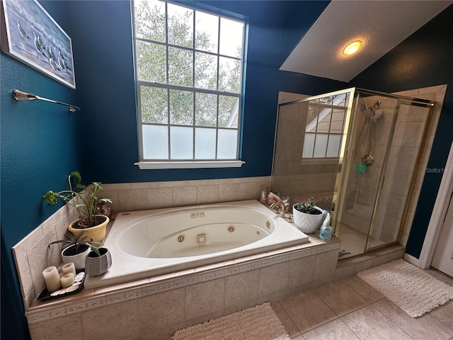 130 Harbour Cove Way, Clermont, FL 34711 - bathroom with a stall shower, a tub with jets, tile patterned flooring, and healthy amount of natural light