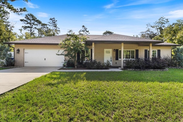 single story home featuring a garage and a front yard