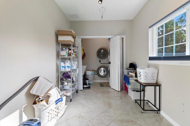 washroom with stacked washer / drying machine