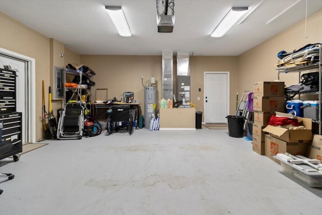 garage with a garage door opener, electric water heater, and heating unit