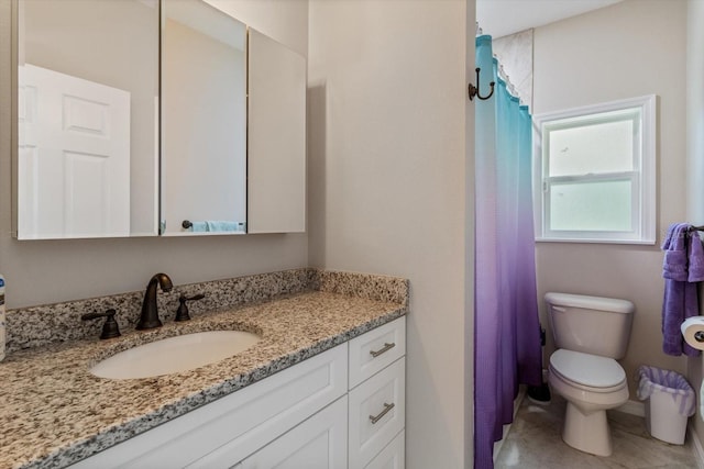 bathroom featuring vanity, toilet, and a shower with shower curtain