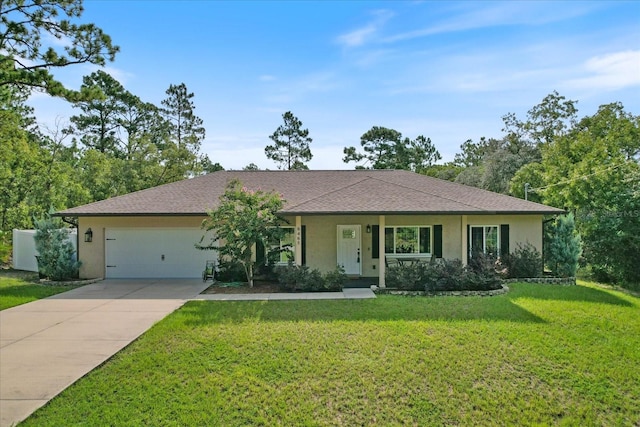 single story home with a garage and a front lawn