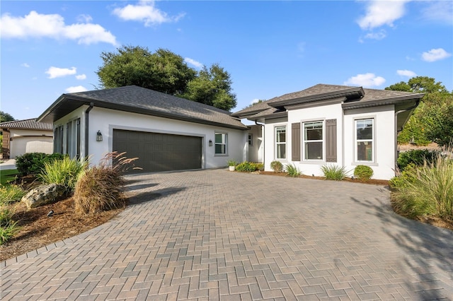 prairie-style home featuring a garage