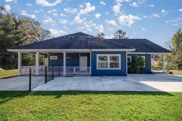 back of house with a porch and a lawn