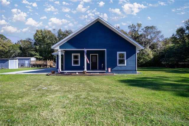 view of front of house featuring a front yard and covered porch