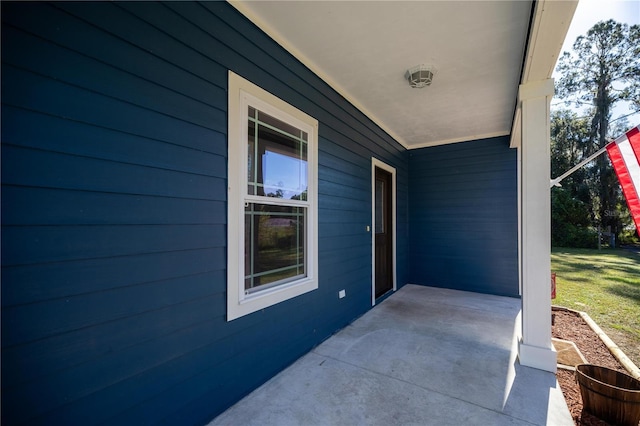 entrance to property featuring a porch