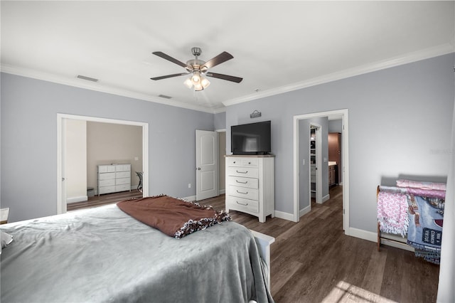 bedroom featuring ornamental molding, ceiling fan, and dark hardwood / wood-style flooring