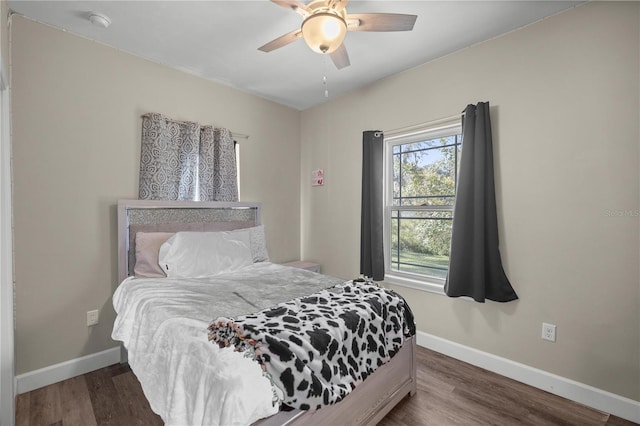 bedroom featuring dark wood-type flooring and ceiling fan