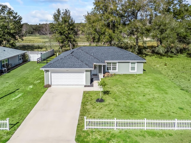 ranch-style house with a garage and a front yard