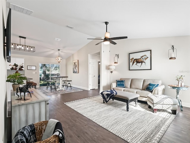 living room with dark wood-type flooring, ceiling fan, and vaulted ceiling