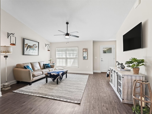 living room featuring vaulted ceiling, ceiling fan, and dark hardwood / wood-style flooring