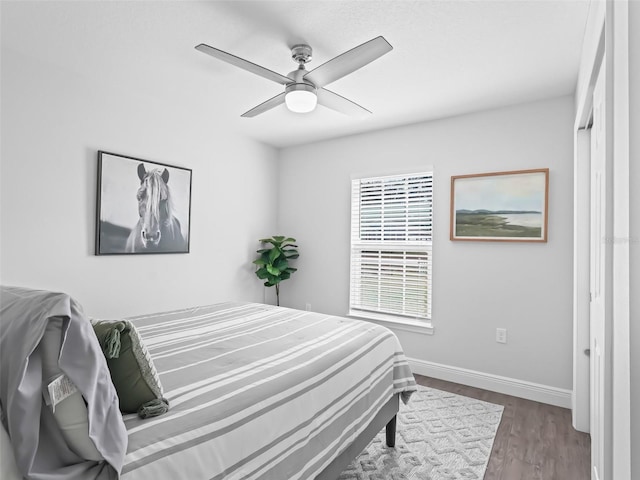 bedroom featuring hardwood / wood-style floors and ceiling fan